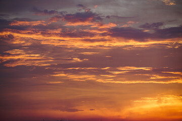 Colorful sky background. sunset with orange dramatic sky at dawn. Natural Bright Orange Dramatic Sky In Sunset Dawn Sunrise. Amazing Bold Golden Sunset Sunrise Sky Background.