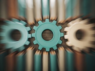 Three cogwheels in teal and beige with a blurred, zoom effect, symbolizing teamwork, mechanics, or collaboration.