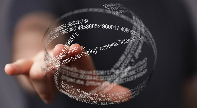 Hand interacting with a digital globe showing data streams and code. Concept for technology, data, and innovation.