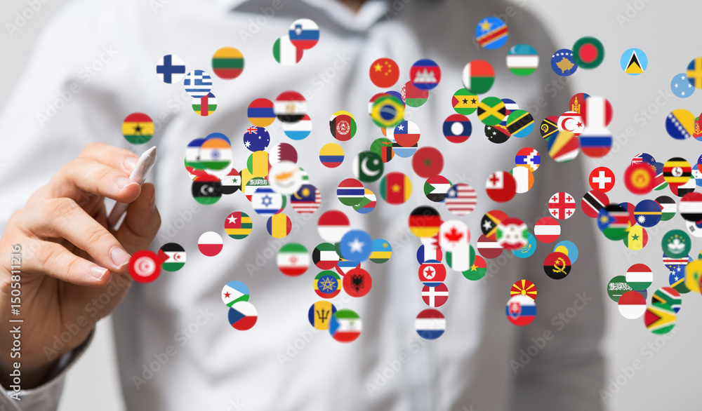 Leinwandbilder image of person interacting with a digital display of world flags, representing global connectivity.