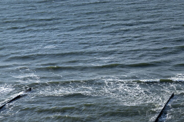 Fototapeta premium Calm ocean waters with hints of waves