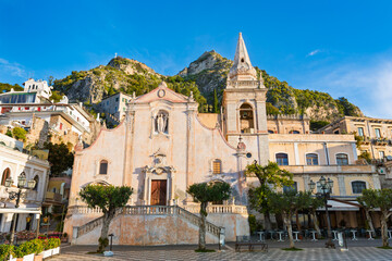 Morning view of Piazza IX Aprile with the Church of San Giuseppe in Taormina, Sicily. The historic square offers a stunning perspective of Taormina's charming architecture and landscape