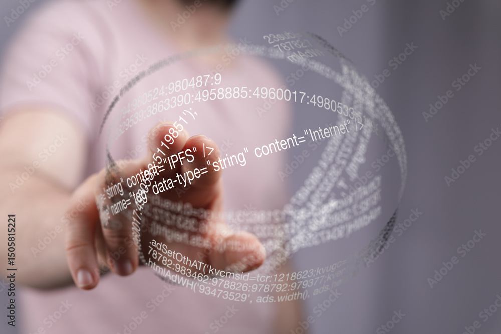 Poster close-up of a hand interacting with a futuristic holographic display showing code.