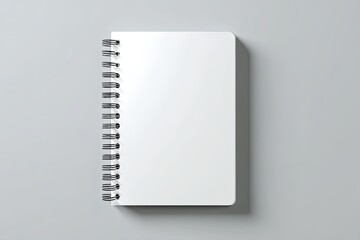 Blank spiral-bound notebook on a gray background