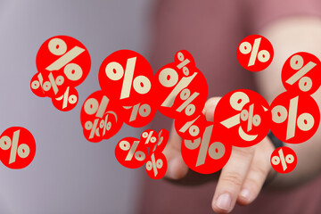 Attractive image of percentage symbols floating around a hand, perfect for sales and discounts.