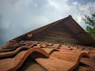Old house roof with blue sky background