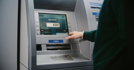 Unrecognizable Person Entering PIN Code on ATM Keypad to Withdraw Money. Error Message on Cash...