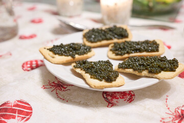 Russian caviar eggs served on small, thin and delicate toast with butter