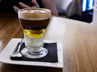 Asian coffee. This is a typical coffee from Cartagena (Spain). It is made with liqueur, lemon zest,...