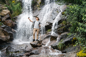 asian male selfie while hiking