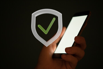 Image of a smartphone with a check mark in a shield, symbolizing security and verification.