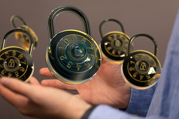 Image of hands holding digital combination locks, symbolizing data protection and cybersecurity.