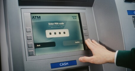 ATM User Entering PIN Code on ATM Keypad for Money Withdrawal. Error Message on Cash Machine Screen...