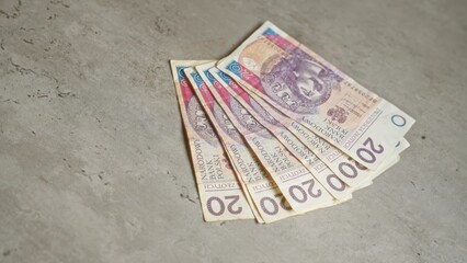 Banknotes of polish zloty on a concrete surface highlighting currency from poland in a modern...