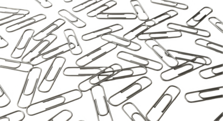 Transparent Background Photo of Metallic Paperclips Scattered Randomly
