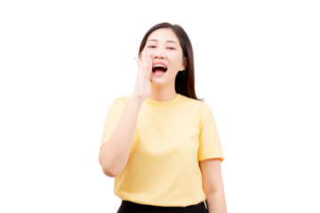 Asian young beautiful woman in a yellow shirt calling out with her hand near her mouth.