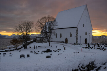 Church and cemetery in the sunrise, Norway