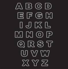 Black and white alphabet letters with chalk design on a school blackboard
