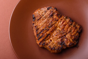 Meat, steak, beef tenderloin cooked on grill. Juicy steak as a food background