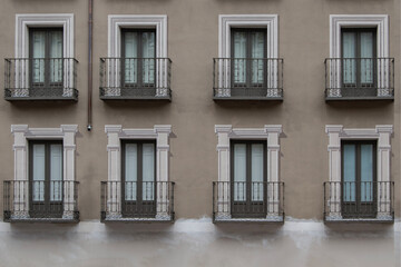 facade with balconies with painted lintels simulating marble frames