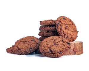 Close-up of crunchy chocolate chip cookies placed on a wooden slice, perfect for food advertising. Isolated on White Background