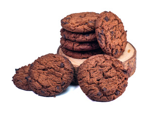 Close-up of crunchy chocolate chip cookies placed on a wooden slice, perfect for food advertising. Isolated on White Background