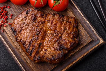 Meat, steak, beef tenderloin cooked on grill. Juicy steak as a food background