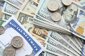 American US dollars money bills and US social security number card close up