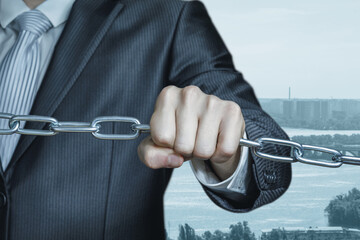 A man holding chains symbolises a business connection.
