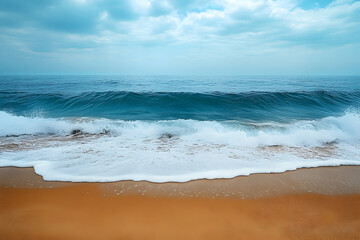Gentle waves crashing on a sandy shore.