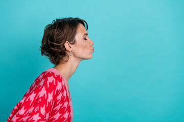Photo portrait of lovely young lady profile kiss empty space dressed stylish red garment isolated...