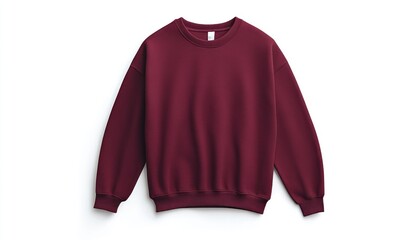 A maroon colored sweatshirt with long sleeves is placed on a white surface in a studio setting