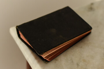 old book on wooden table, old book, black cover book
