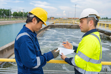 Environmental engineers work at wastewater treatment plants,Water supply engineering working at...
