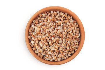 Boiled buckwheat in a ceramic bowl isolated on white background. Top view. Flat lay