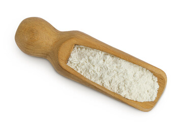 White flour in wooden scoop isolated on white background. Top view. Flat lay.
