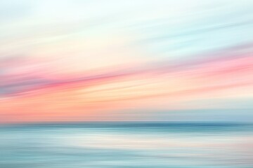 Fototapeta premium Pastel sunrise over water, soft motion blur