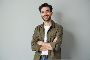 A smiling man wearing a green shirt and jeans, suitable for casual photography or illustration