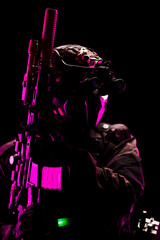 Modern tactical soldier with advanced equipment under dramatic lighting