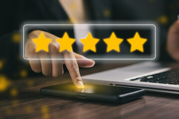 A close-up hand touching a smartphone screen to give a five-star rating, symbolizing positive customer experience, excellent service review, and satisfaction in digital business.