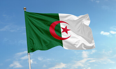 Algerian national flag with crescent and star waving in the sky
