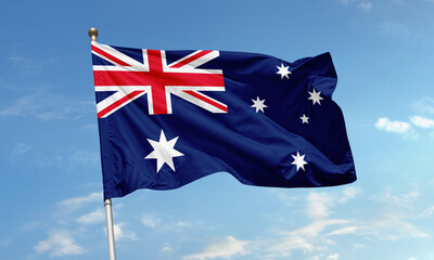 Australian national flag flying high in the sky with Union Jack and Southern Cross star...