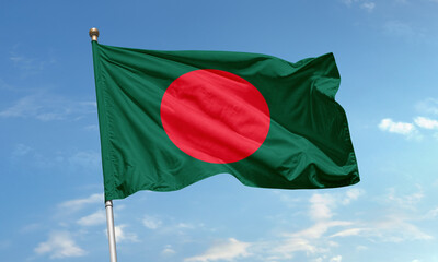 Bangladesh national flag with red circle on green background symbolizing the country's bloodshed for independence and lush landscape