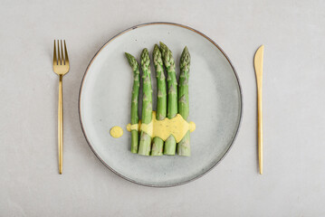 Green asparagus stems on a plate