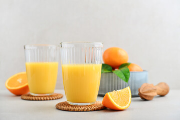 Orange fresh squeezed juice in glass and glasses jug
