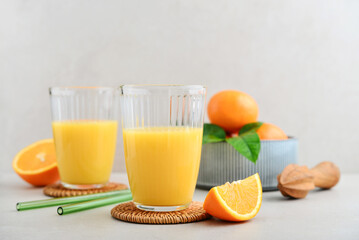 Orange fresh squeezed juice in glass and glasses jug
