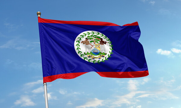 Belize national flag waving under blue sky