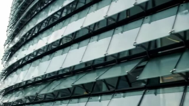 Futuristic architecture: glass panel movements on a modern building facade