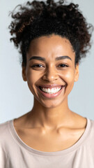 Happy African American Woman Smiling and Looking at Camera