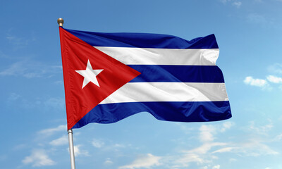 Cuban national flag with star waving under clear blue sky